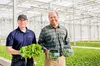 Revolution Farms' head grower Tam Berage with co-founder, chairman and CEO John Green.