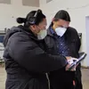 Melanie Thompson and Chase Iron Eyes, of the Standing Rock Sioux Tribe in South Dakota, prepare to call voters before Election Day. (Lakota People’s Law Project)