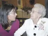 Granddaughter Michelle Boyden shares a special moment with
Margaret Baer during Baer’s 100th birthday party. Boyden, whose son
Zachary wrote a biography on Baer, and a dozen other Primrose
re