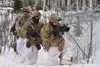 Paratroopers from C Company, 3rd Battalion, 509th Parachute Infantry Regiment attack the Combined Arms Collective Training Facility in the Donnelly Training Area on Feb. 11, 2021, as part of 