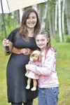 Ava Hays and her Tanaina Elementary kindergarten teacher Austin Grimes pose with Ava’s doll, Kit. Grimes sent Ava the doll after the girl underwent spinal surgery in Seattle in July. Courtesy