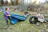 Willow resident Mary Weis begins the clean-up effort on her property just off the Parks Highway Monday afternoon. Weis said besides her family's belongings scattered throughout the yard she a