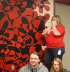 Wasilla High School Band Director Jackie Johnson tears up after hearing their music program just won $10,000. Jacob Mann/Frontiersman
