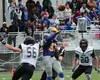 Bartlett quarterback Zai Malia-Hughes has his arm hit as he throws by Colony linebacker Cooper Sant. during Colony's 47-6 win over the Golden Bears at Bartlett High School Friday, Aug. 12, 20