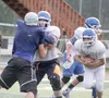 A Palmer running back follows his blocker for a gain in a scrimmage against Soldotna during the Chugiak Stampede Aug. 9 at Chugiak High School. Palmer opens its 2014 season Aug. 15 against We