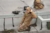 Electronics Technician 1st Class Nigel Brown, attached to Explosive Ordnance Disposal (EOD) Mobile Unit One, conducts high-frequency radio communications from Joint Base Elmendorf-Richardson 