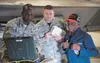 U.S. Air Force Staff Sgt. Stephen Teamer, 477th Fighter Group quality assurance inspector, operates a portable maintenance aid during a quality insurance inspection with Army Air Corps Staff 