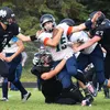 Redington juniro Kyler Rumfelt (15) breaks through a scrum of Nikiski tacklers Saturday at Nikiski High School. Joey Klecka/Peninsula Clarion
