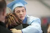 Burchell High School graduate Zech Millette hugs his mother, Jolynn Millette, after Friday’s graduation at the Curtis D. Menard Memorial Sports Center in Wasilla. Burchell is celebrating its 