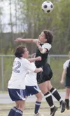 ROBERT DeBERRY/Frontiersman Colony’s Brittney Anderson tries to
head the ball during the championship game against Soldotna.
