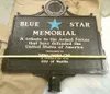 Valley Garden Club member Jerry Zeitz uses a level to check the
pole that the Blue Star Memorial Plaque will be mounted to Saturday
at the Honor Garden in Wasilla. (ROBERT DeBERRY/Frontiersma