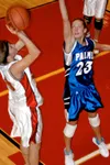 Palmer's Emily Bolling defends as Wasilla's Lindsey Wesser takes
a shot during the Warriors 52-43 win over the Moose at Wasilla High
School on Friday. Photo by JEREMIAH BARTZ/ Frontiersman.