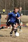 Rick Knapp brings the ball up the field for Palmer in the first
half of Wednesday's game against Colony. Photo TIM
BRODT/Frontiersman.