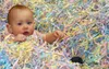 Above, 11-month-old Amelia Adams plays in the "grass" at the
Frontiersman/Fred Meyer Easter Egg Hunt Saturday afternoon. More
than 400 children took part in the annual event. CASEY
RESSLER/Fr