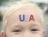 Jaylynn Gangstad, 4, shows her fourth of July spirit with USA
across her forehead before the start of the 2010 parade in Wasilla.
(Frontiersman file photo)