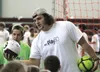 Seattle Seahawks offensive lineman Kristjan Sokoli hands a soccer ball to a participant during the Mat-Su Play 60 Challenge Thursday, July 7, 2016, at the Menard Center in Wasilla. With help 