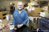 The Food Pantry of Wasilla Executive Director Eddie Ezelle
stands inside the storeroom at the pantry’s Wasilla location.
(ROBERT DeBERRY/Frontiersman) Robert DeBerry
