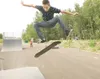 ROBERT DeBERRY/Frontiersman Bryan Ducharme, 15, performs a trick
called a kick-flip off the side of the pyramid box at the Palmer
Skate Park Thursday afternoon. The official opening for the p