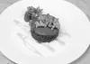Chef Clay Randolph makes his desserts from scratch at Wasilla
Area Seniors Inc., like this chocolate coffee cake with fresh
raspberries, caramelized pecans and a honey drizzle. (Photo
courtes
