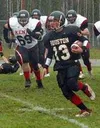 Houston's Peter Clemens runs away from a group of Kenai
defenders in the Hawks' loss to the Kardinals in 3A playoff action
at Houston High Saturday. Photo by FRANK AMEDURI/ Frontiersman.