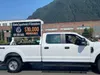 The Alaska Department of Corrections advertises a $10,000 hiring bonus during the 2022 Fourth of July Parade in Juneau. A listing of state employees' gross pay shows more than half of the top