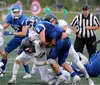Palmer quarterback Ben Simmerman is tackled by a pair of defenders during a loss to Colony. Jeremiah Bartz/Frontiersman