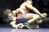 ROBERT DeBERRy/Frontiersman Wasilla'€™s Derek Johnson, bottom,
grapples with East'€™s Nathan Hoffer during Saturday'€™s 140-pound
championship match at the Lancer Smith Memorial at Palmer Hig