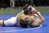 Colony junior Marcus Riedlinger works to bring Lathrop senor Jacob Spencer to his back during the 113-pound Division I final of the ASAA/First National Bank State Wrestling Championships Satu