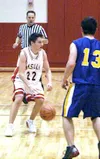 Greg Gray moves the ball past a Homer defender during Wasilla's
win over the Mariners at Wasilla High Friday. Gray led the Warriors
with 23 points in the contest.JEREMIAH BARTZ/ Frontiersman