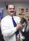 New Animal Care and Regulation Chief Officer Dave Allison stands
with an adoptable cat at the Animal Care shelter. Photo by RINDI
WHITE/Frontiersman.