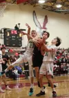 Houston's Brandon Hina pulls down a rebound during a win over Redington. Bruce Eggleston/matsusports.net