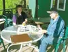 Patti Kepler-Swanson, left, looks through family albums with her
father, David Kepler, at the family's park. Five generations of
Keplers have helped develop the park, which attracts thousands