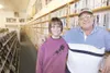 ROBERT DEBERRY/FRONTIERSMAN Bill Wilson and his daughter Corinna
stand next to a wall of VHS tapes inside the family owned Wilson’s
Wasilla Video.