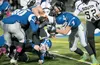 A trio of Palmer Moose stop a South Anchorage High drive Saturday night during large-schools quarterfinal competition at Machetanz Field in Palmer. ROBERT DeBERRY/Frontiersman.com