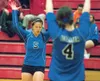 Morgan Morfe and Jessica Cole raise their arms in celebration
after scoring during Tuesday’s match. (ROBERT
DeBERRY/Frontiersman) Robert DeBerry