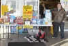 Frank Roach collects items and donations for the Boxes For Heroes program  outside Three Bears on the Palmer-Wasilla Highway in February 2010. LANIER HUTCHESON/Frontiersman