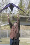 ROBERT DeBERRY/Frontiersman Valley resident Edric Mosman
releases a kite into the wind during Saturday’s first Alaska Kite
Festival in Palmer.