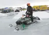 Iron Dog racer Darrick Johnson rides through 12 inches of water
on Big Lake before the start of the 2010 Iron Dog Snowmachine race.
Warm weather, melting snow, overflow and plowed up snow ber