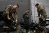 Members of the 673d Civil Engineer Group don Mission-Oriented Protective Posture training gear during Exercise Polar Force 23-2 at Joint Base Elmendorf-Richardson, Alaska, Nov. 16, 2022. Read