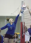 Palmer's kasara Brandenburg send the ball back over the net
during Palmer's quarter final win over the Chugiak Mustangs at the
First National Bank/ASAA State Volleyball Championships Thursday