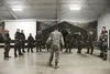 Senior Airman Alexander Barton, 773d Civil Engineer Squadron emergency management trainer, instructs a Chemical, Biological, Radiological, and Nuclear defense survival skills training class a