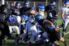 Palmer senior Nick DeBach makes a cut inside a crowd of Thunder Mountain Falcons during a 28-26 win during the medium-schools state semifinals Saturday at Palmer HIgh School. Palmer advanced 