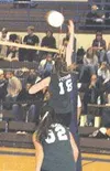 Colony's Anna Peters knocks a shot across the net in the third
game of Tuesday's junior varsity match between Colony and Palmer.
Photo by TIM BRODT/Frontiersman.