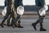 U.S. Airman from the 3rd Wing, 176th Wing, and 477th Fighter Group conduct a foreign object debris walk on the flightline at Joint Base Elmendorf-Richardson, Alaska, April 26, 2019. Airmen co
