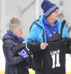 Darcy and Mike Logan were surprised prior to Palmer's varsity hockey game against Delta Jan. 31. Their son Jaxon, a former Palmer High hockey standout, died in 2005. Palmer High retired Jaxon