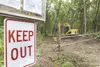A keep out sign and locked gate block the entrance to Usibelli Coal Mine's Wishbone Hill access road near mile 55.5 of the Glenn Highway in this 2010 file photo. A lawsuit was filed Tuesday c