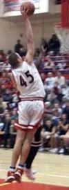 Wasilla's Ray Schafer goes up for the slam after registering a
steal in the early moments of the Warriors' contest against rival
Colony. Photo by JEREMIAH BARTZ/ Frontiersman.