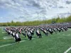 Mat-Su Career and Technical High School 2021 graduates sit on the Colony High School football field. The Mat-Su Borough School District anticipates 1100 graduates for the Class of 2022. Front