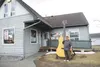 Hank Hartman stands next to a 12-foot guitar statue outside Matanuska Music on Friday. The statue is 4 feet taller than a limit listed in design standards approved by the Wasilla Planning Com
