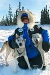 Martin Buser comforts his lead dog, Inca, right, and Snake, on
the trail from his home near Big Lake. BOB
MARTINSON/Frontiersman